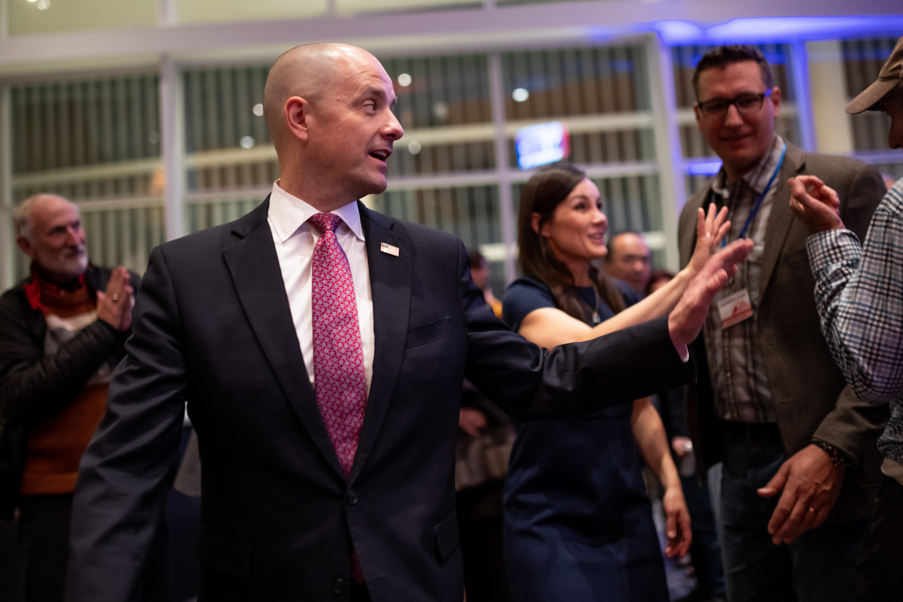 Independent senate candidate Evan McMullin and his wife, Emily Norton McMullin, wave after greeting supporters during an election night watch party at the Mid-Valley Performing Arts Center in Taylorsville on Tuesday. McMullin is running against incumbent Republican Sen. Mike Lee.