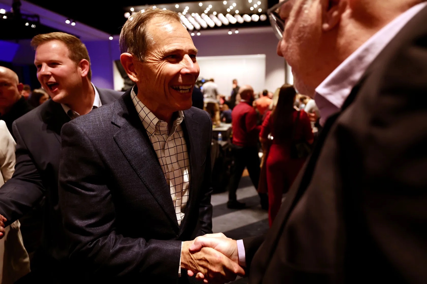 Rep. John Curtis, R-Utah, talks with people in the crowd at an election party at the Hyatt Regency in Salt Lake City on Tuesday.