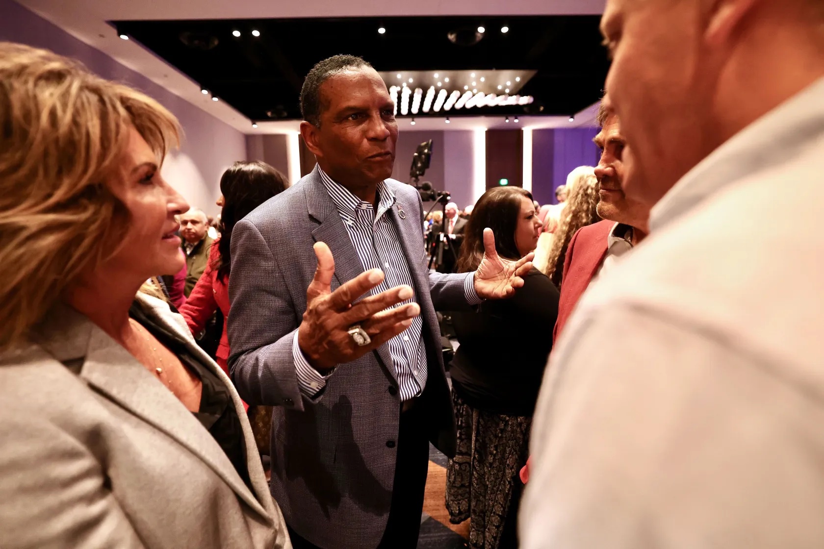 Rep. Burgess Owens, R-Utah, talks with people in the crowd at an election party at the Hyatt Regency in Salt Lake City on Tuesday.