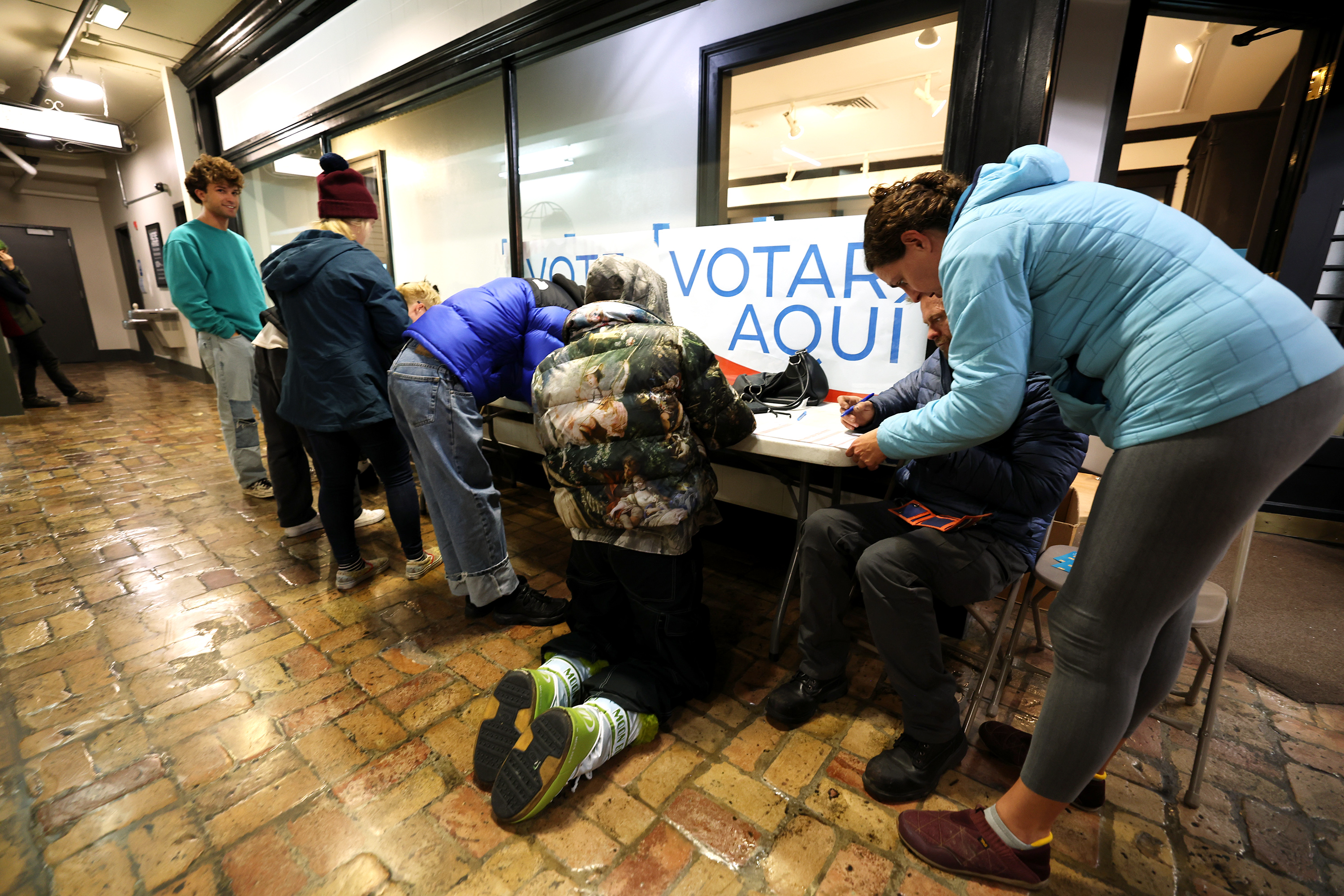 Voters fill out papers prior to voting at Trolley Square in Salt Lake on Tuesday.