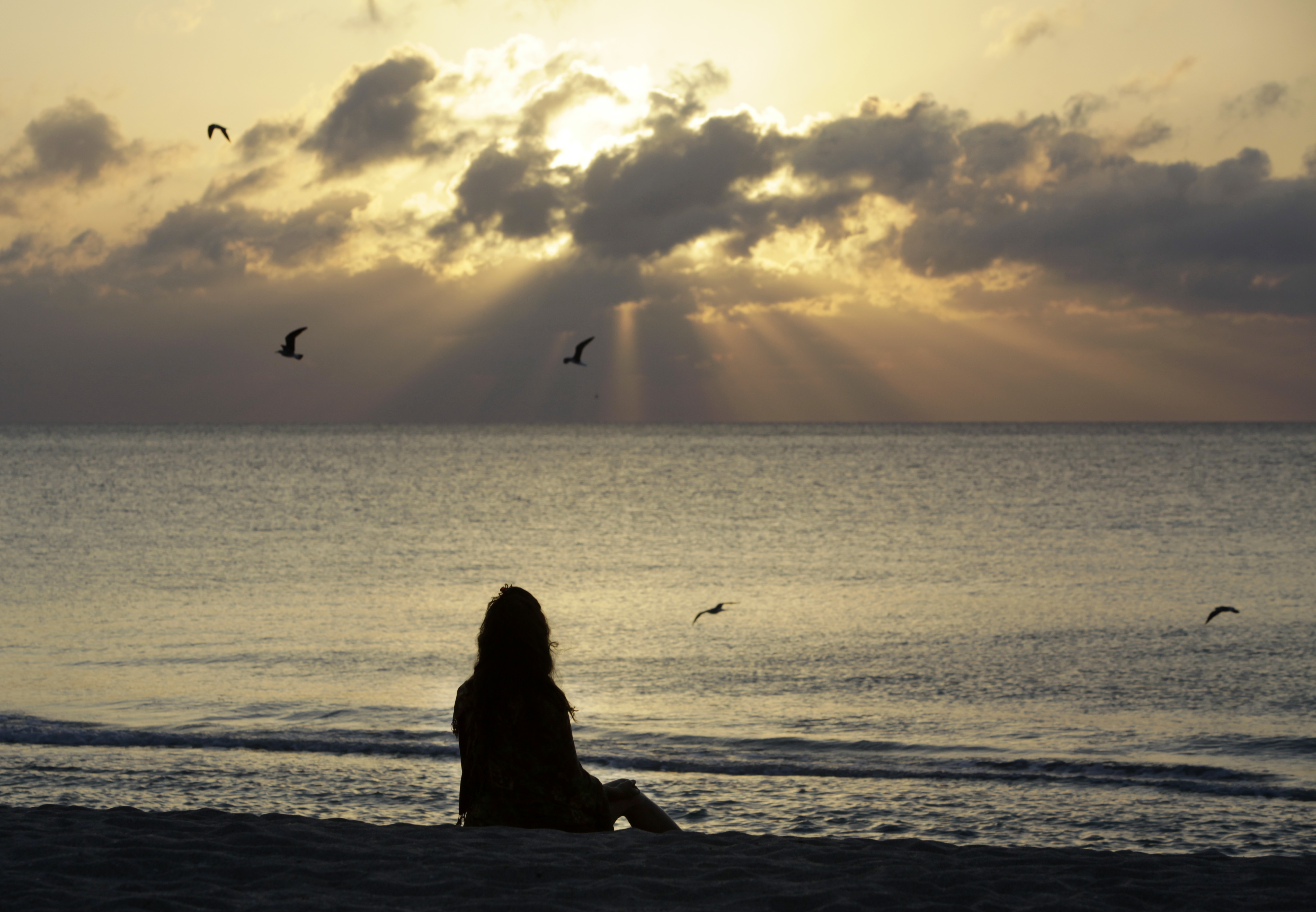 A woman meditates on the beach in Miami Beach, Fla. According to a study published Wednesday in the journal JAMA Psychiatry, mindfulness meditation worked as well as a standard drug for treating anxiety in the first head-to-head comparison.