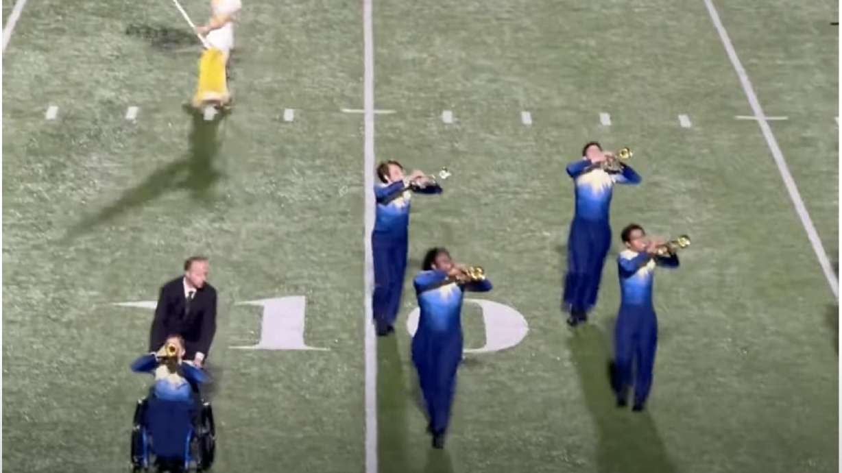 Thanks to a band director going out of his way, a student in a wheelchair is able to fully participate in a high school marching band.