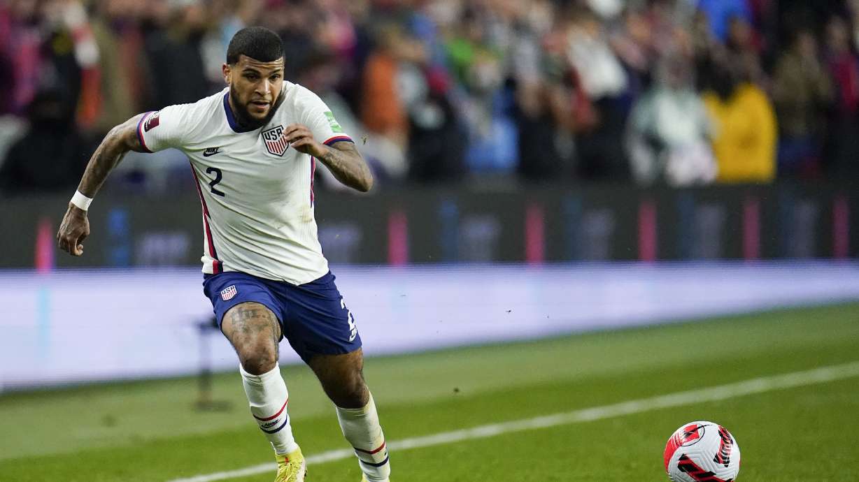 United States' DeAndre Yedlin chases the ball during the first half of a FIFA World Cup qualifying soccer match between Mexico and the United States, Friday, Nov. 12, 2021, in Cincinnati.