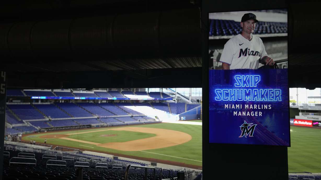 An image of Skip Schumaker, new manager of the Miami Marlins baseball team, is broadcast on a screen inside loanDepot Park, Thursday, Nov. 3, 2022, in Miami.