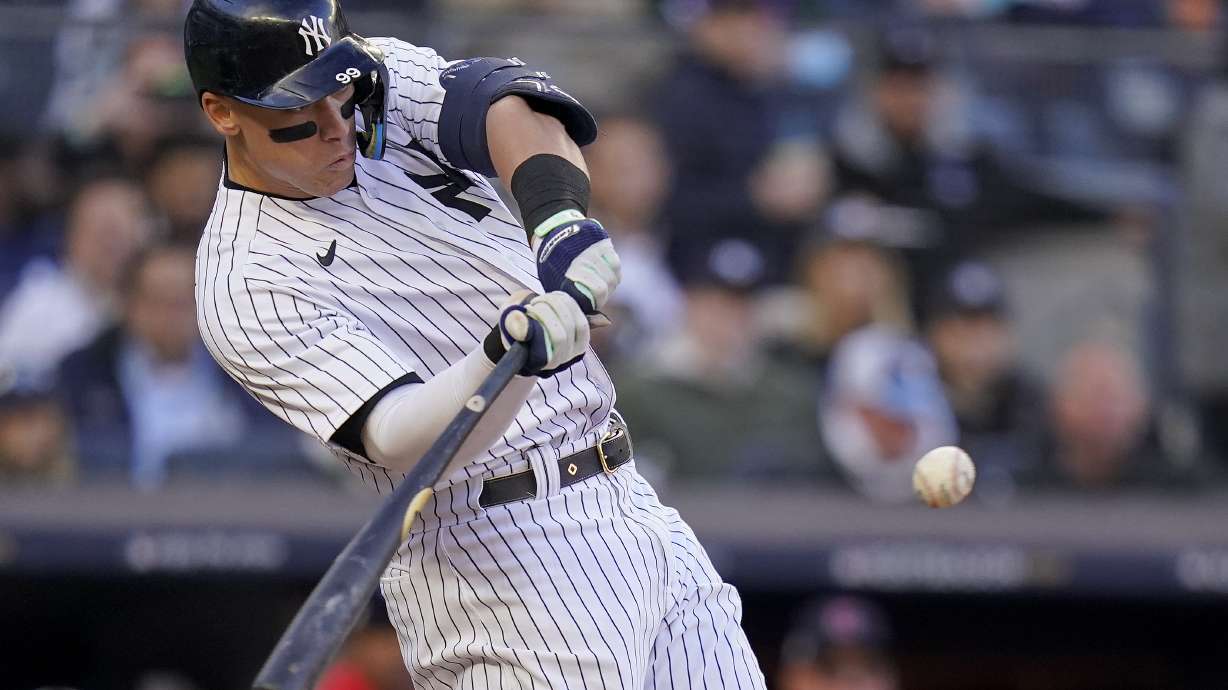 New York Yankees center fielder Aaron Judge connects for a solo home run during the second inning of Game 5 of an American League Division baseball series against the Cleveland Guardians, Tuesday, Oct. 18, 2022, in New York.