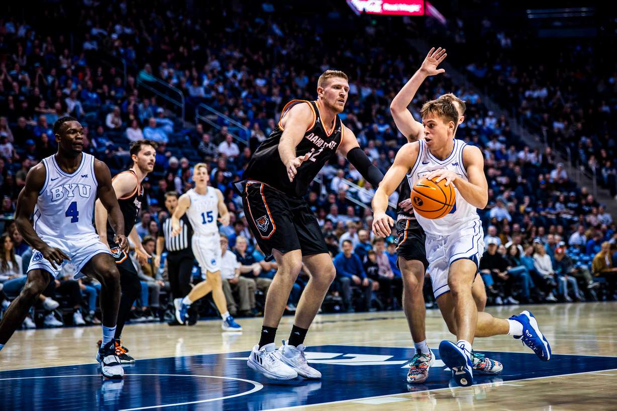 BYU freshman Dallin Hall dribbles around a pair of Idaho State defenders during the Cougars' 60-56 win over the Bengals in the 2022-23 season opener, Monday, Nov. 7, 2022 in the Marriott Center in Provo.