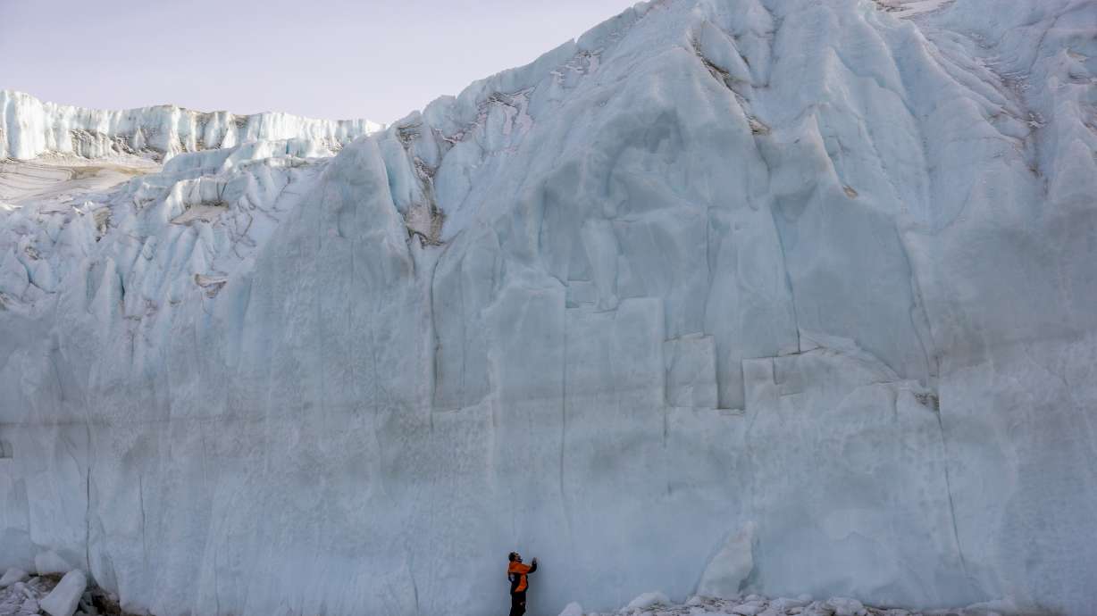 Shayne Misselbrook stands in front of a glacier in the Taylor Valley in Antarctica on Oct. 27.