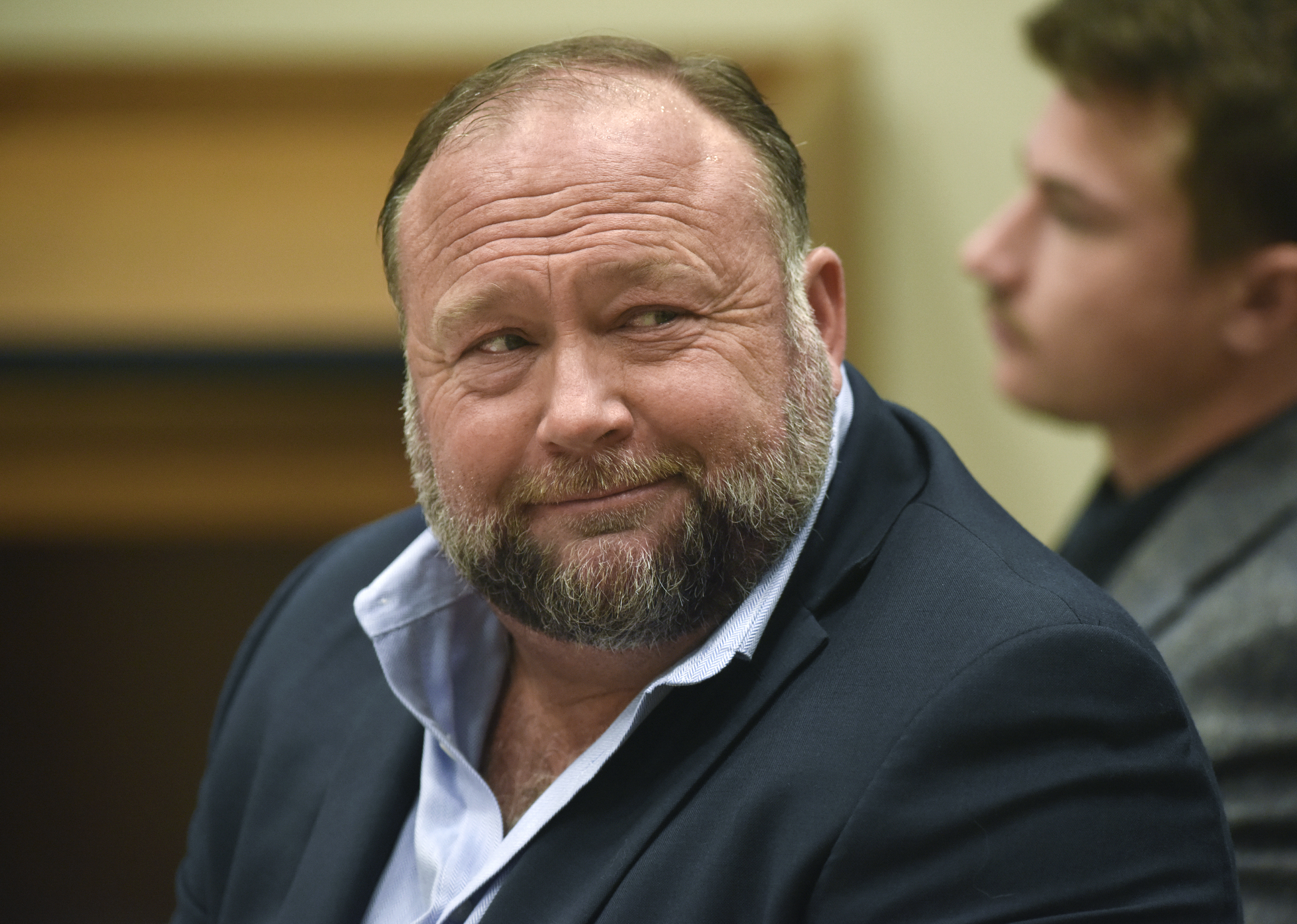 Infowars founder Alex Jones appears in court to testify during the Sandy Hook defamation damages trial at Connecticut Superior Court in Waterbury, Conn., on Sept. 22. Jones and his company have been ordered to pay an extra $473 million to families and an FBI agent for calling the 2012 Sandy Hook school shooting a hoax.