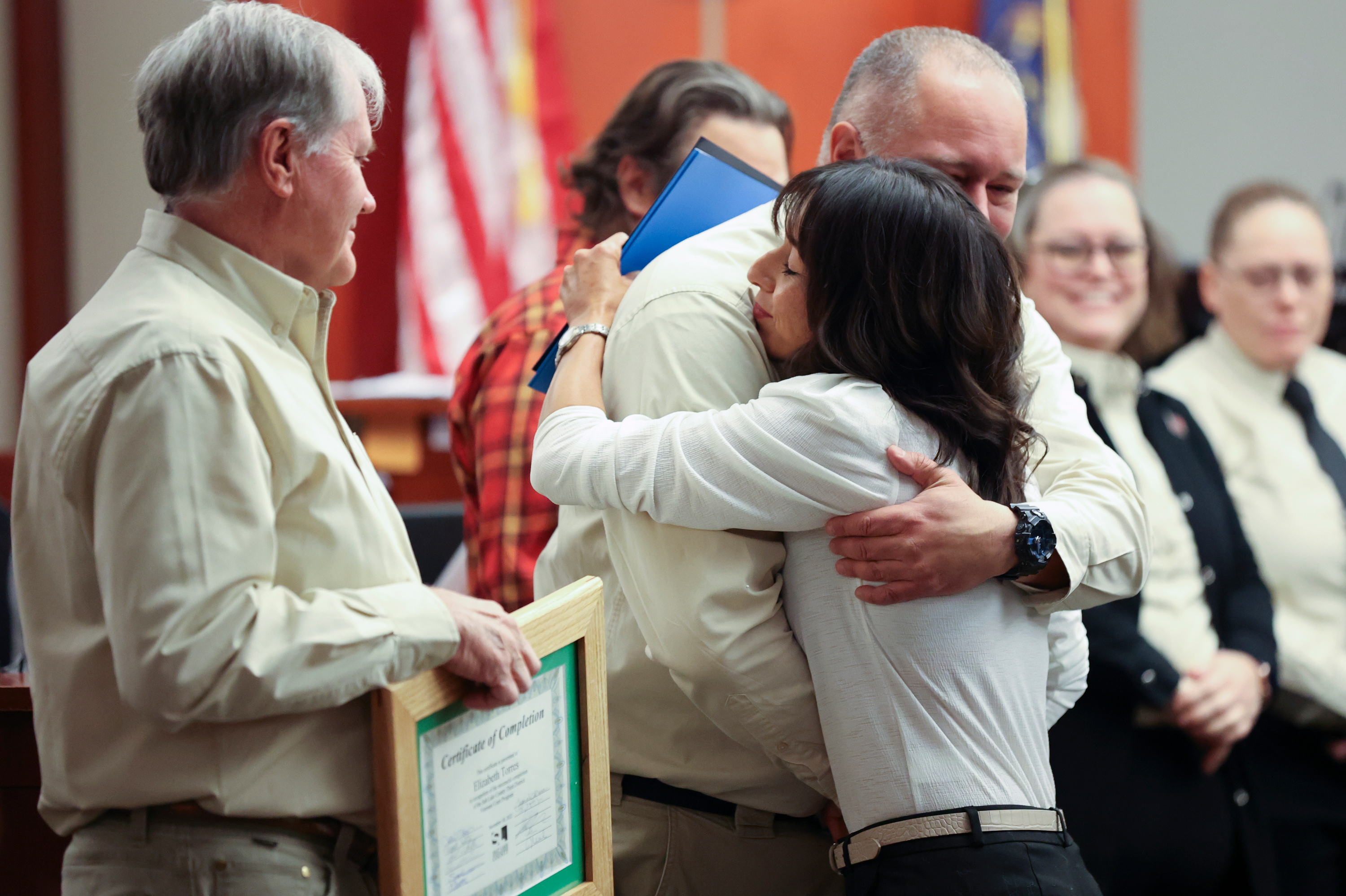 Al Palmer, Salt Lake County veterans treatment court mentor coordinator, hugs Air Force veteran Elizabeth Torres as she graduates from veterans court at the Matheson Courthouse in Salt Lake City on Thursday. Four veterans on Thursday celebrated new beginnings when they graduated from the Utah veterans treatment court program after overcoming post-service challenges. 