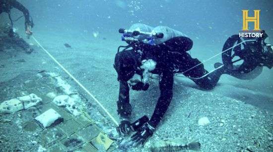 Underwater explorer and marine biologist Mike Barnette and wreck diver Jimmy Gadomski explore a 20-foot segment of the 1986 Space Shuttle Challenger that the team discovered in the waters off the coast of Florida during the filming of The History Channel’s new series, “The Bermuda Triangle: Into Cursed Waters."