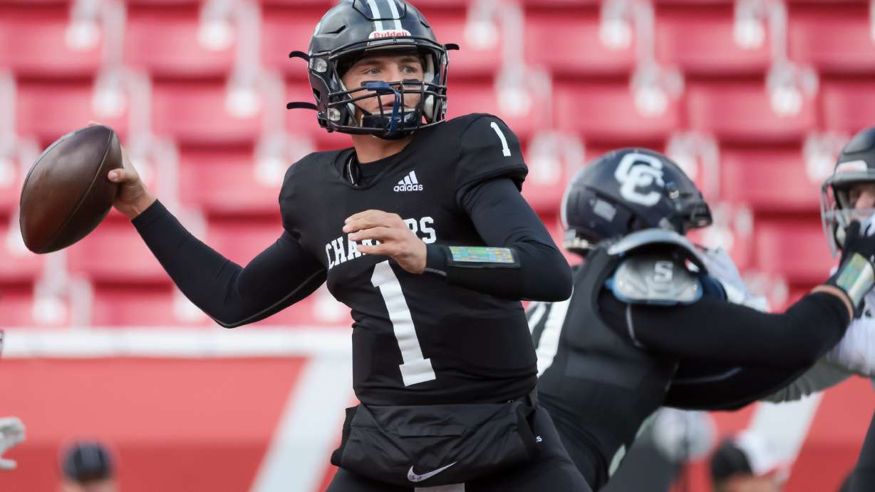 Corner Canyon quarterback Isaac Wilson lines up a pass during a 6A football semifinal against Farmington at Rice-Eccles Stadium in Salt Lake City on Thursday, Nov. 10, 2022. Corner Canyon won, 45-28.