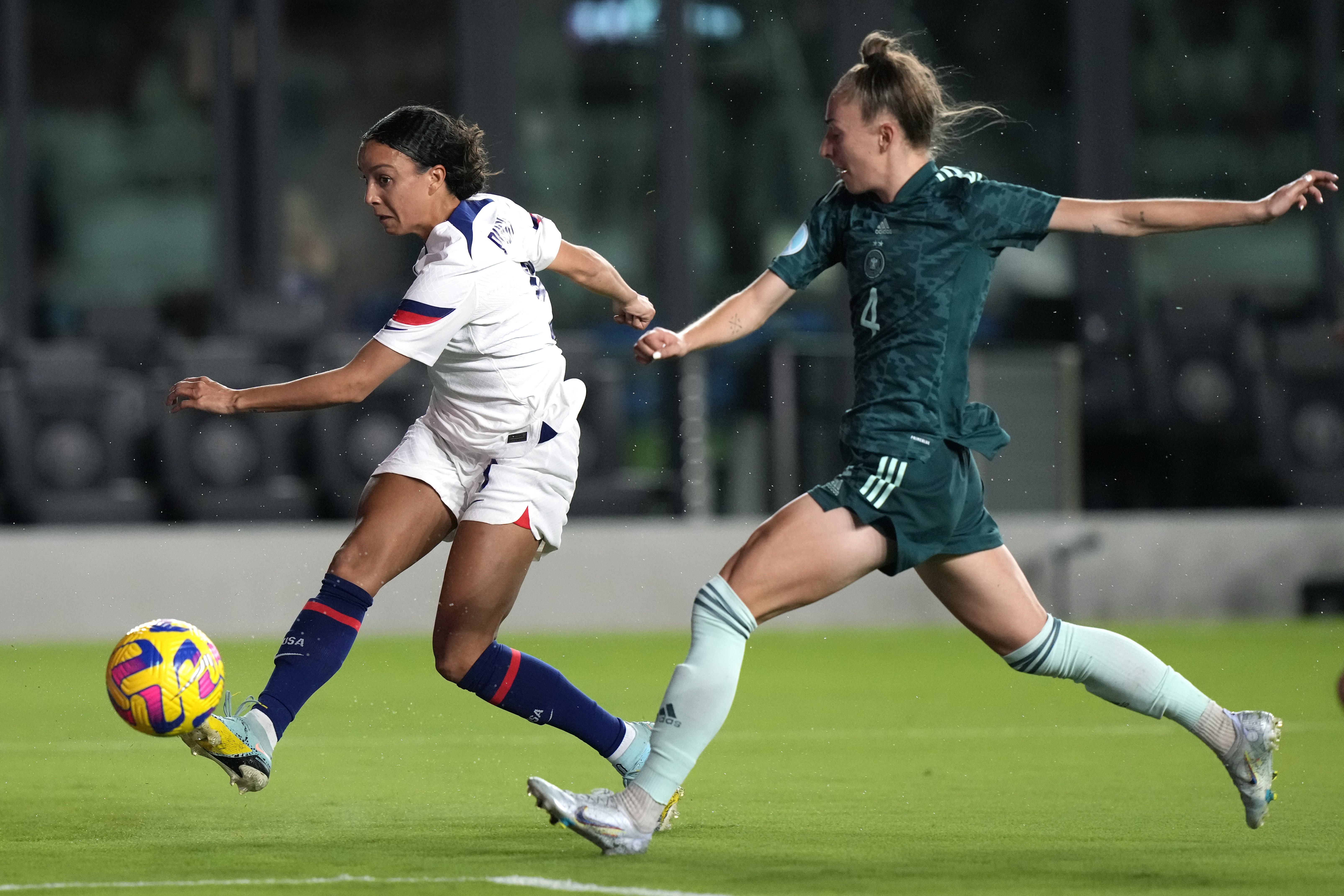 U.S. forward Mallory Pugh, left, attempts a shot on the goal as Germany defender Sophia Kleinherne (4) defends during the first half of an international friendly soccer match, Thursday, Nov. 10, 2022, in Fort Lauderdale, Fla. 