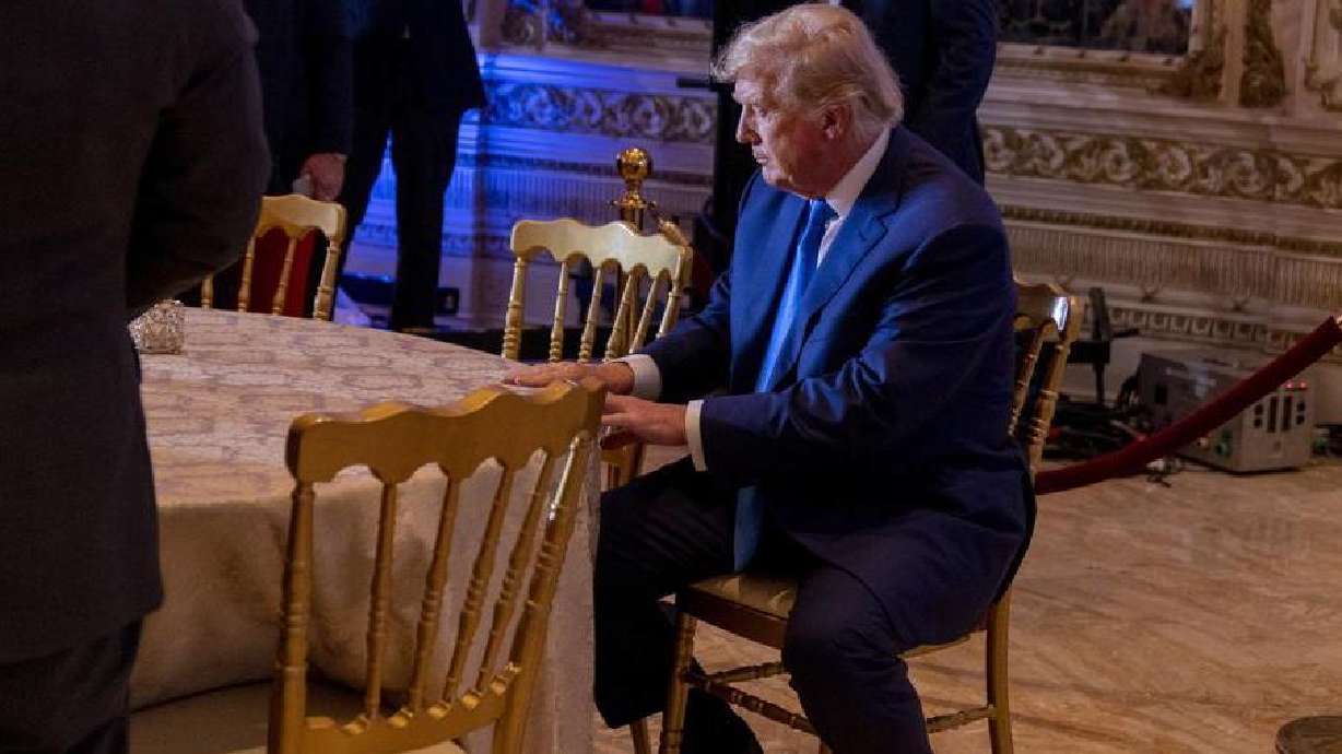 Former President Donald Trump takes a seat at Mar-a-lago on Election Day, Tuesday, in Palm Beach, Florida. Trump is moving forward with his planned Tuesday announcement, pressing on with a third presidential run. His decision comes as members of his party continue to blame him for an unexpectedly poor midterm showing.