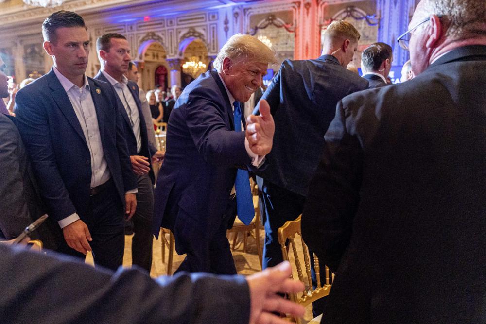 Former President Donald Trump greats guests at Mar-a-lago on Election Day, Tuesday, in Palm Beach, Fla.