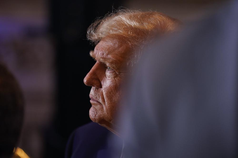 Former President Donald Trump talks to supporters at Mar-a-lago on Election Day, Tuesday in Palm Beach, Fla.