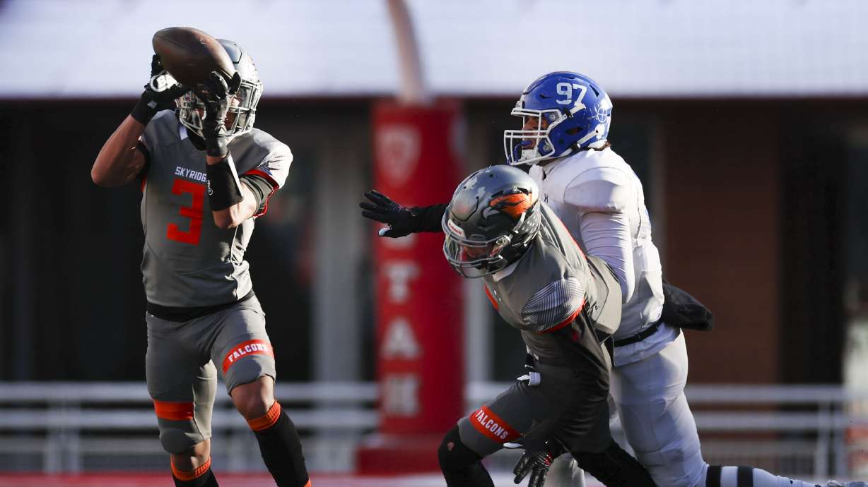 Skyridge’s Smith Snowden (3) intercepts a pass intended and returns it for a touchdown in the 6A state semifinal game at Rice-Eccles Stadium in Salt Lake City on Thursday, Nov. 10, 2022. Skyridge won 45-20.