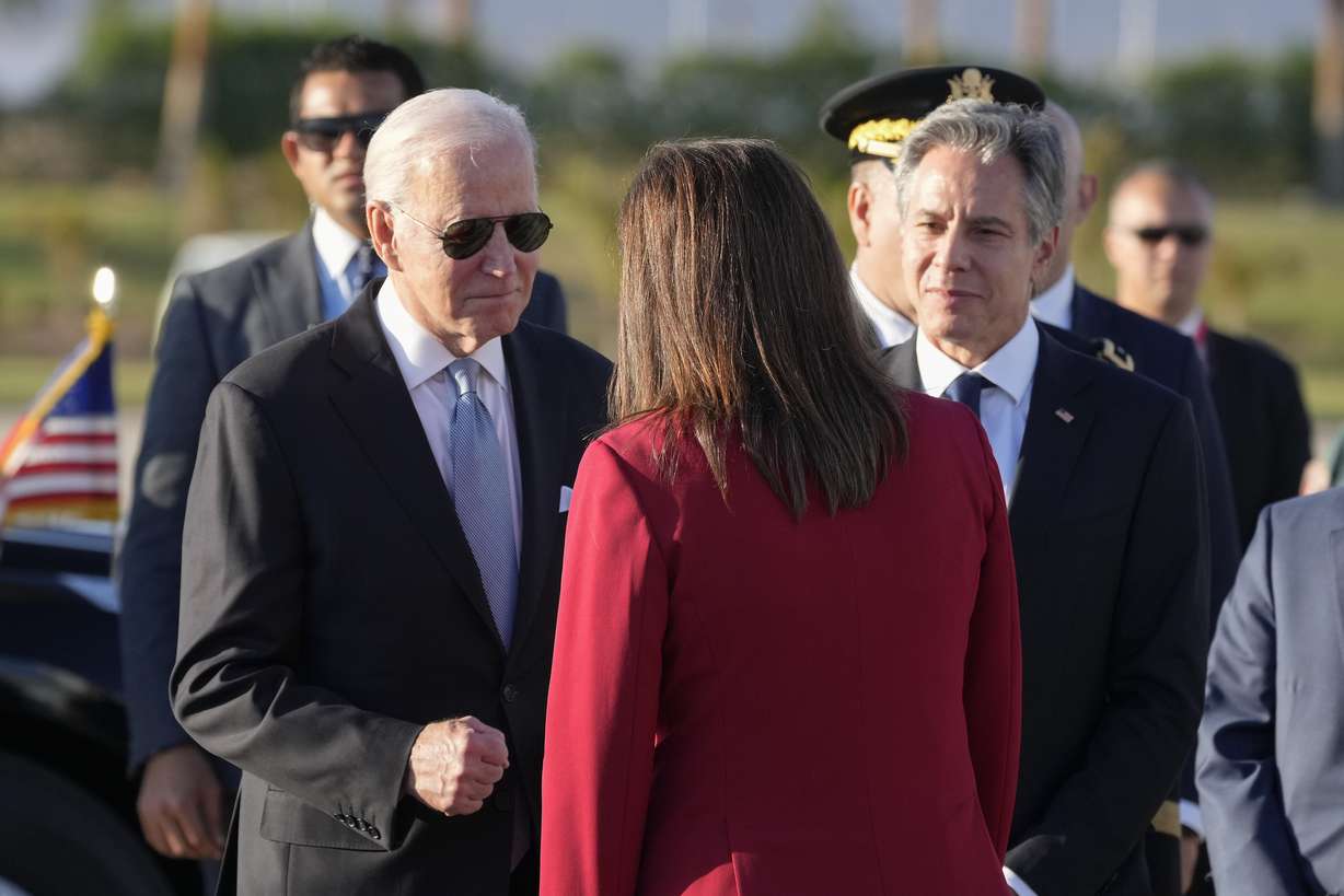 President Joe Biden and Secretary of State Antony Blinken, right, are greeted by Hala Helmy el-Said, Minister of Planning and Economic Development of Egypt, as they arrive Friday at Sharm el-Sheikh, Egypt.