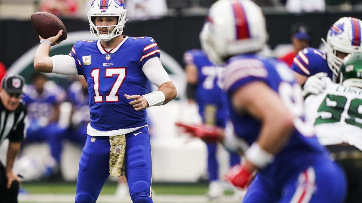 Buffalo Bills quarterback Josh Allen (17) throws a pass to Dawson Knox during the first half of an NFL football game against the New York Jets, Sunday, Nov. 6, 2022, in East Rutherford, N.J.