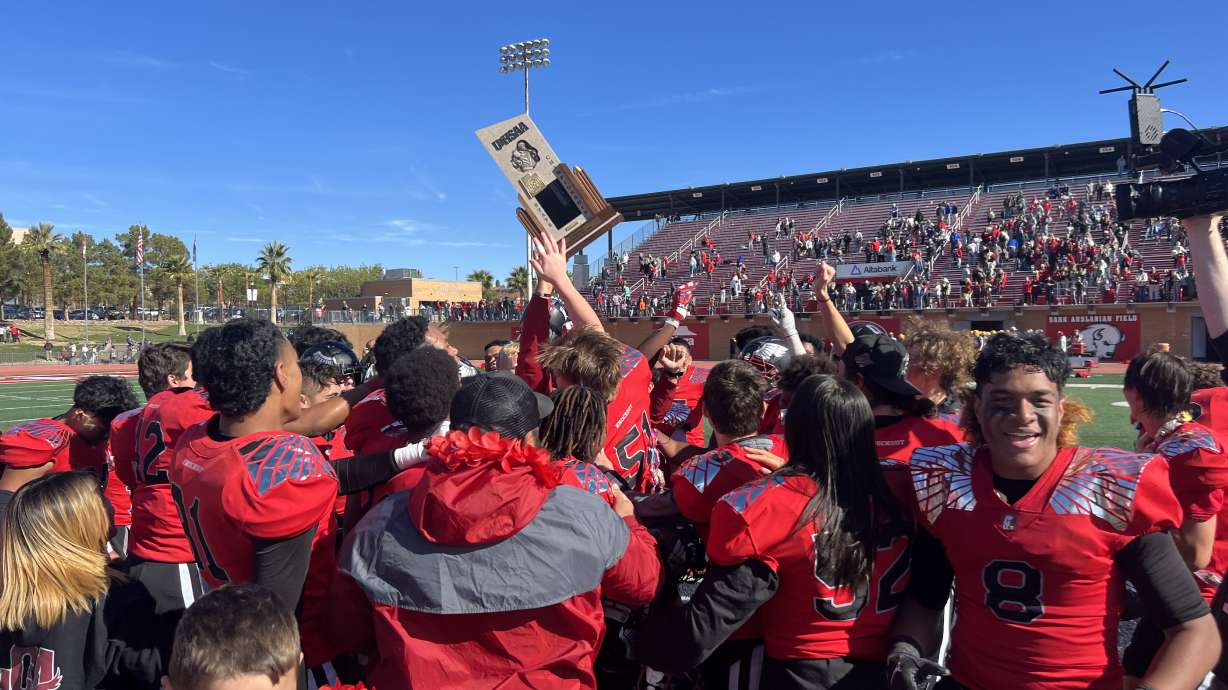 Layton Christian players celebrate after securing a 55-19 win over Kanab to win the 1A state title in St. George on Nov. 11, 2022.