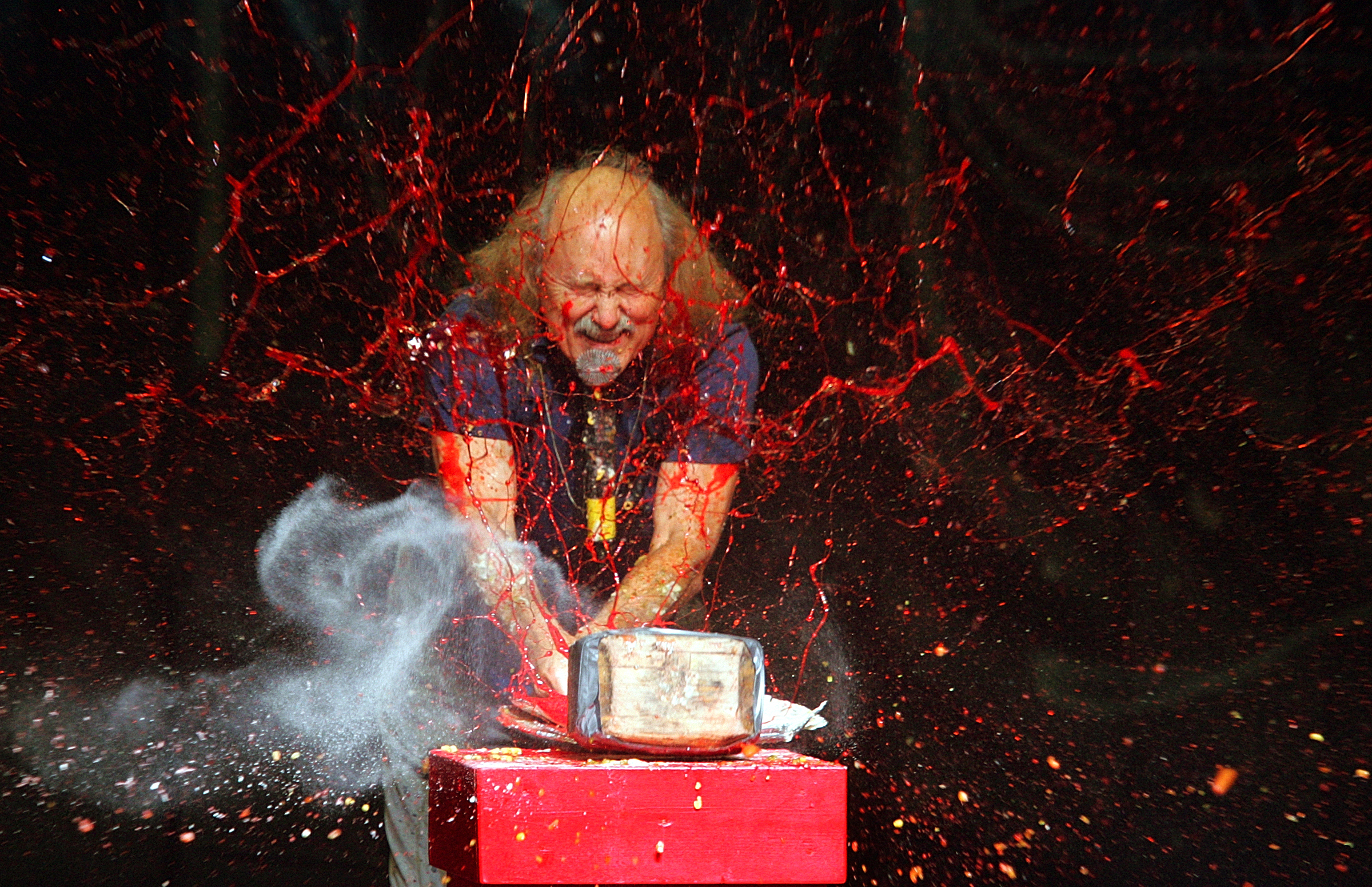 Comedian Gallagher smashes strawberry syrup and flour at the end of his performance at the Five Flags Theater in Dubuque, Iowa on Nov. 18, 2006. Gallagher, the smash-’em-up comedian who left a trail of laughter, anger and shattered watermelons over a decadeslong career, died Friday at his home in Palm Springs, Calif., after a brief illness. He was 76. 