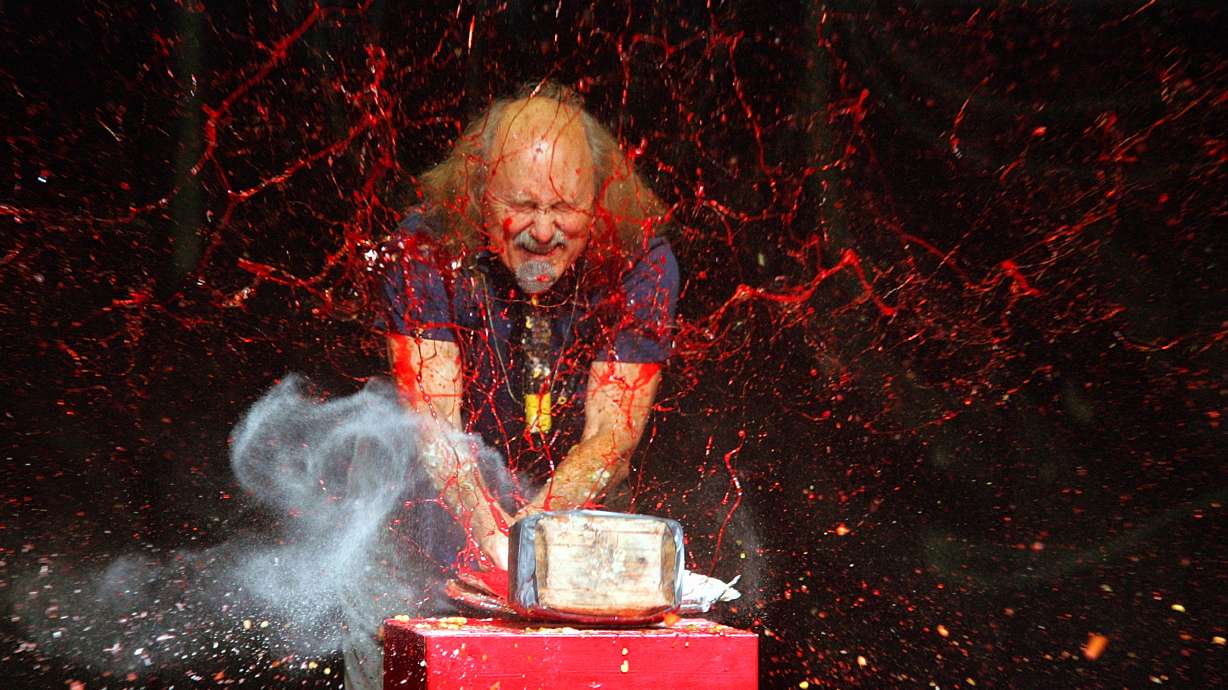 Comedian Gallagher smashes strawberry syrup and flour at the end of his performance at the Five Flags Theater in Dubuque, Iowa on Nov. 18, 2006. Gallagher, the smash-’em-up comedian who left a trail of laughter, anger and shattered watermelons over a decadeslong career, died Friday at his home in Palm Springs, Calif., after a brief illness. He was 76.