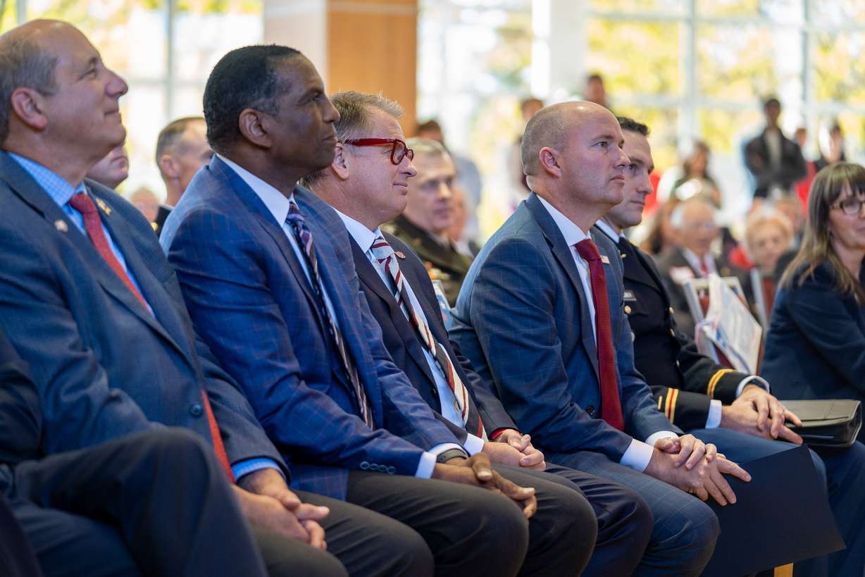 From left, Utah Department of Veterans and Military Affairs executive director Gary Harter, Rep. Burgess Owens, U. President Taylor Randall and Gov. Spencer Cox listen to speakers at the University of Utah's 25th Annual Veterans Day Commemoration Ceremony on the U. campus Friday. Cox and Randall on Friday each shared heartfelt messages during the U.'s 25th annual ceremony.