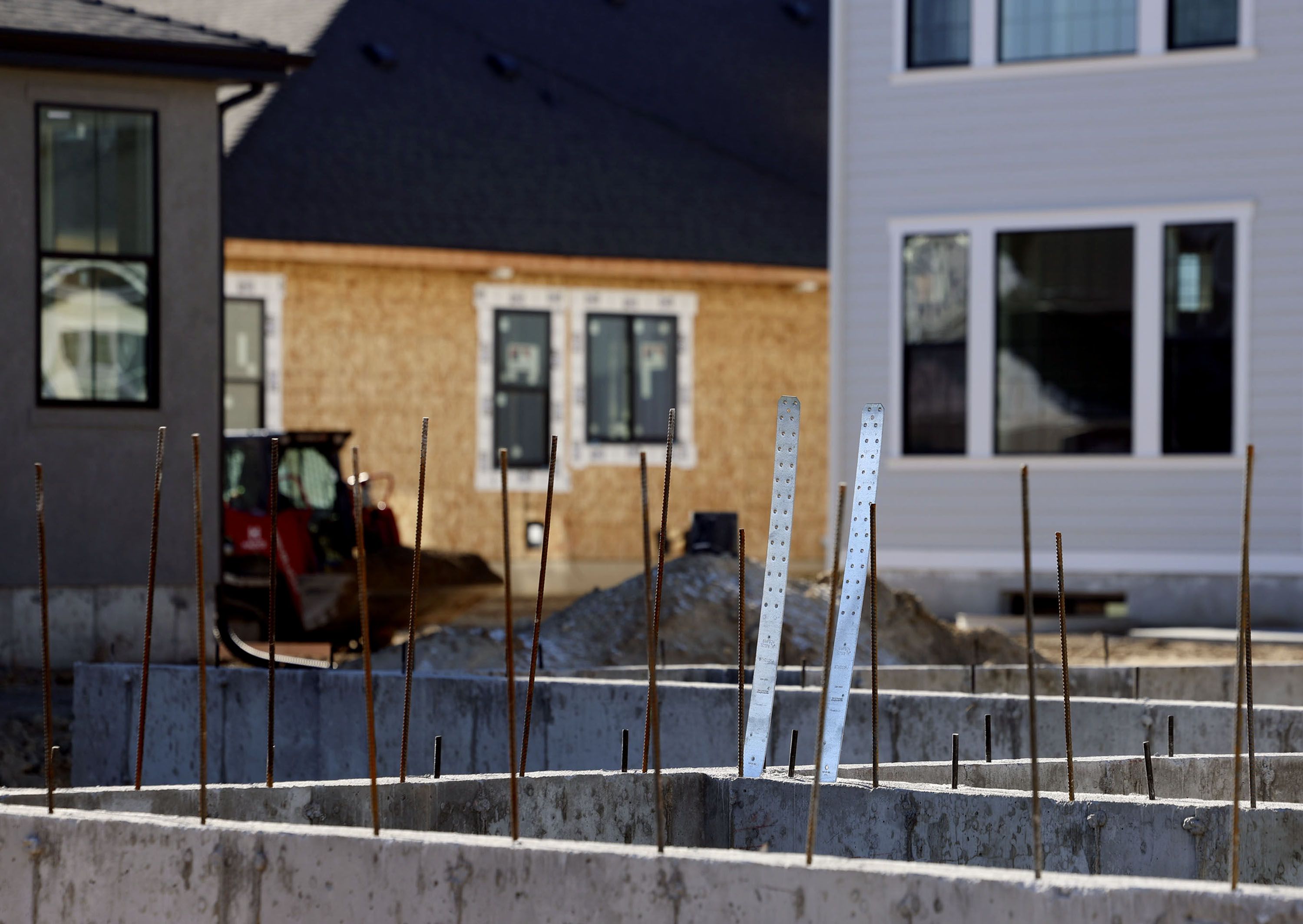 Homes in Big Willow Creek Estates are under construction in Draper on Friday.