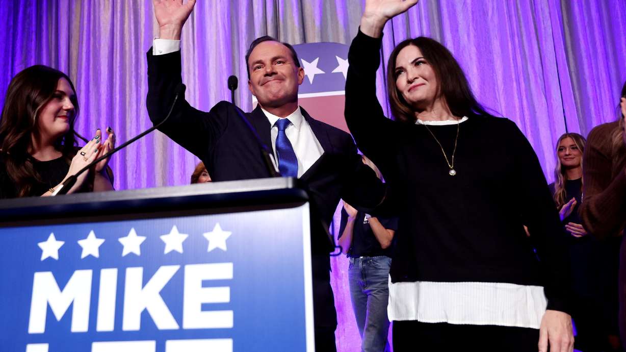 Sen. Mike Lee speaks to a crowd of supporters at an election party at the Hyatt Regency in Salt Lake City on Tuesday. Lee was joined onstage with his wife Sharon Lee, and other family and friends.