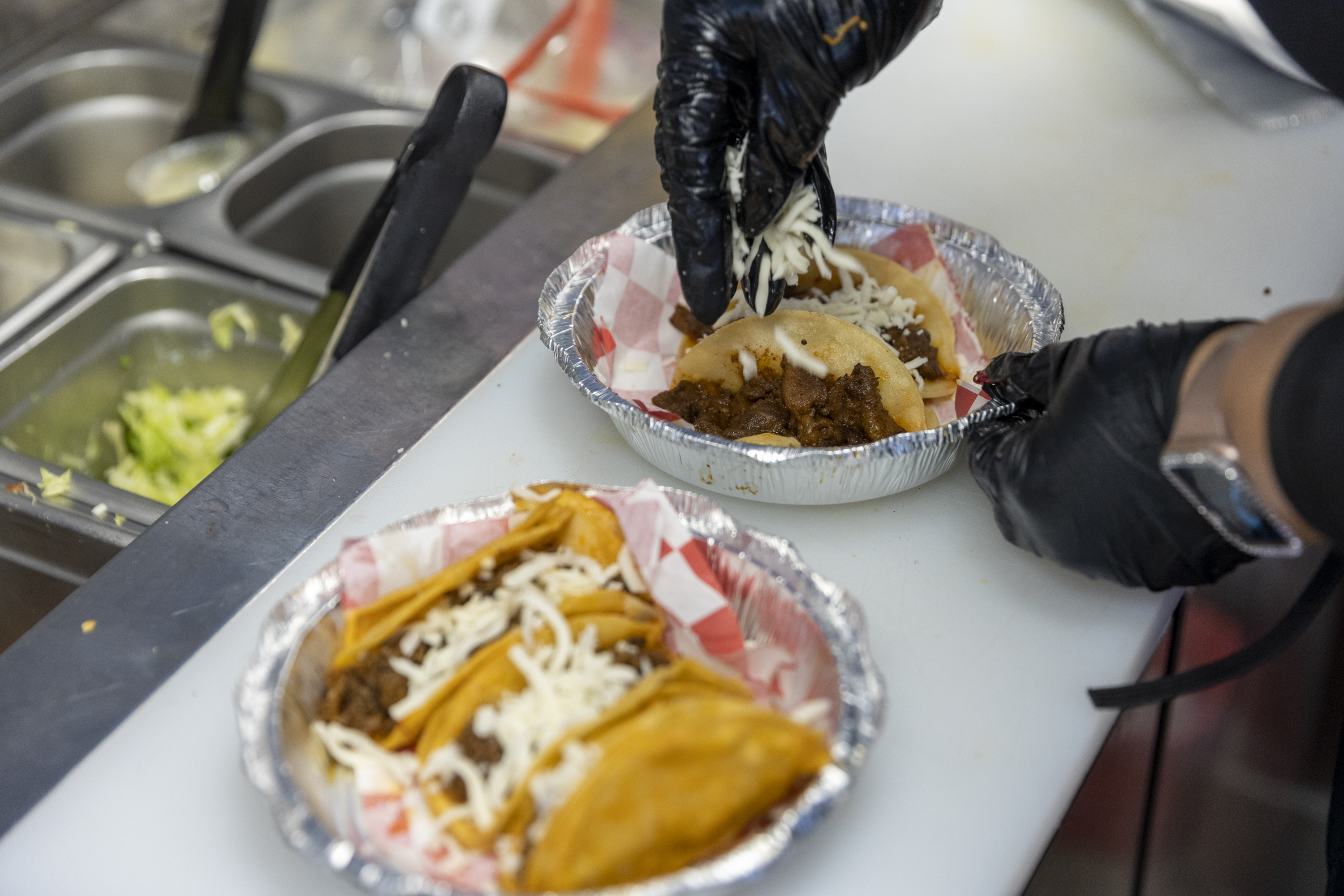 Patricia Parral prepares tacos at TacoMania in Riverton on Saturday.