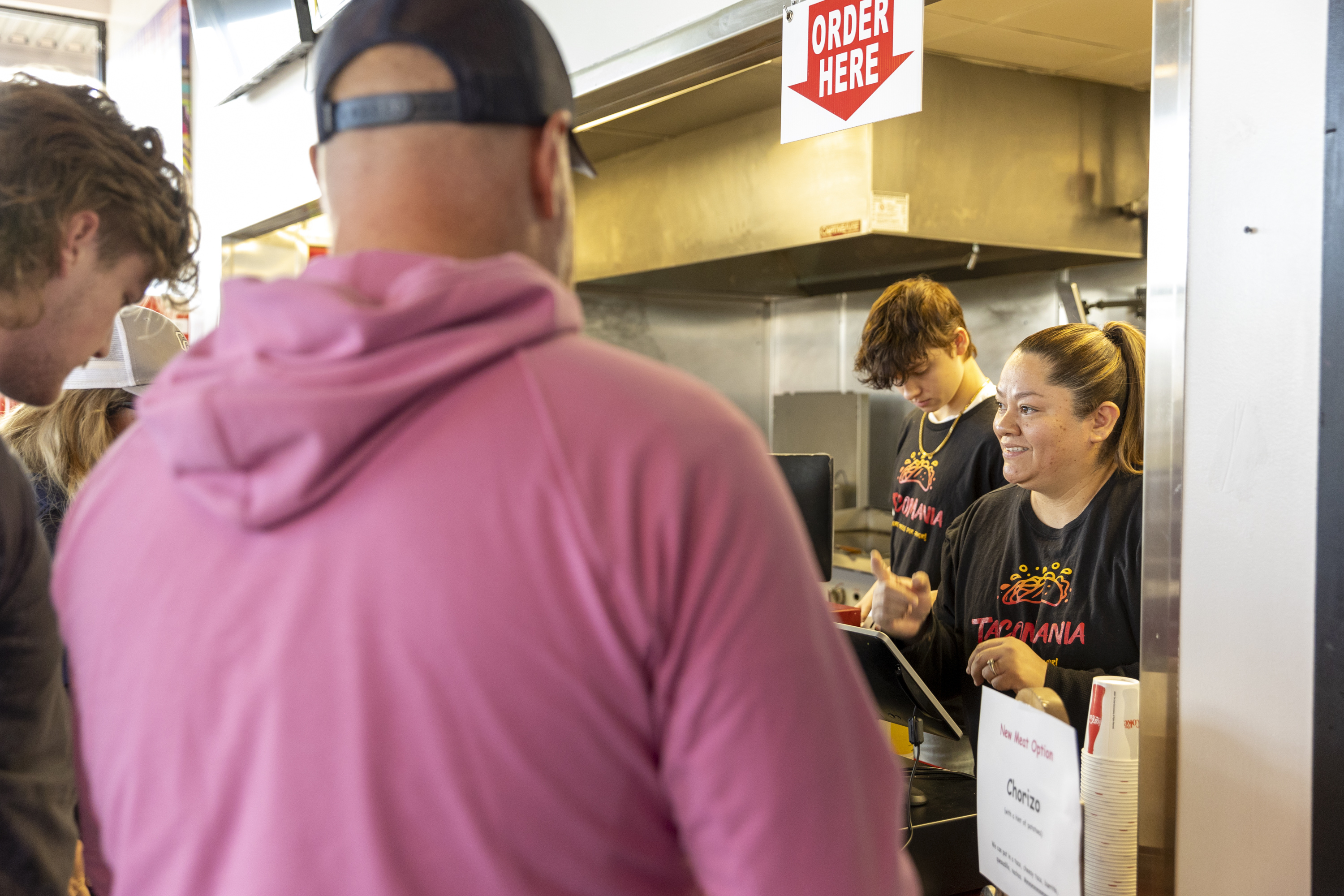 Claudia Martinez waits on customers  at TacoMania in Riverton on Saturday.