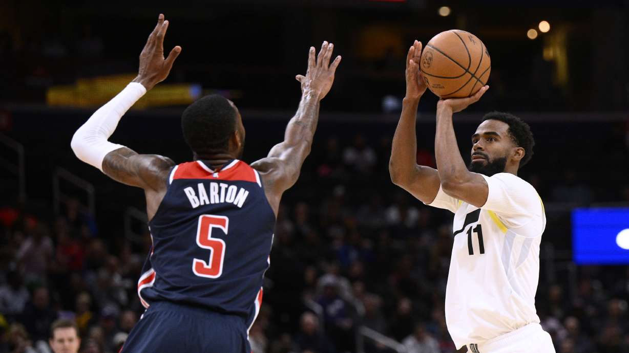 Utah Jazz guard Mike Conley (11) shoots against Washington Wizards forward Will Barton (5) during the first half of an NBA basketball game Saturday, Nov. 12, 2022, in Washington.