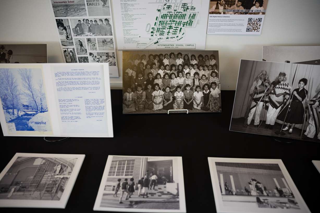 Photographs from various Native American boarding schools are displayed during a panel discussion hosted by Utah Diné Bikéyah at the Leonardo Museum in Salt Lake City on Saturday.