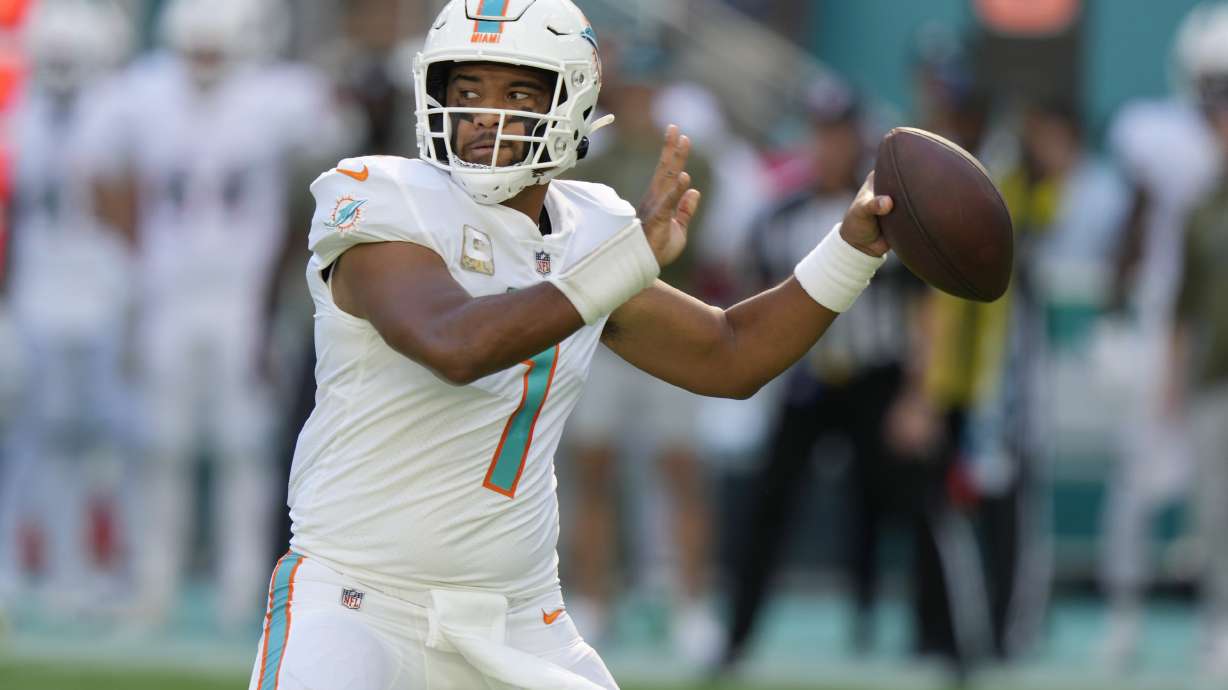 Miami Dolphins quarterback Tua Tagovailoa (1) aims the ball during the first half of an NFL football game against the Cleveland Browns, Sunday, Nov. 13, 2022, in Miami Gardens, Fla.