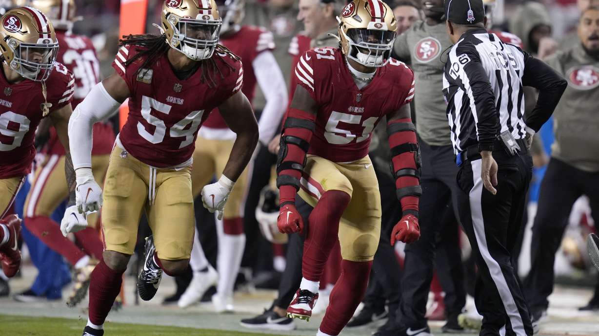 San Francisco 49ers linebacker Fred Warner (54) and linebacker Azeez Al-Shaair (51) celebrate during the second half of an NFL football game against the Los Angeles Chargers in Santa Clara, Calif., Sunday, Nov. 13, 2022.