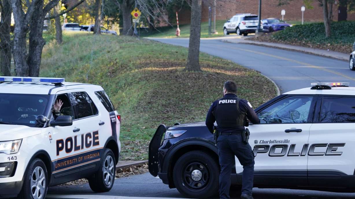 Charlottesville police secure a crime scene of an overnight shooting at the University of Virginia, Monday, Nov. 14, 2022, in Charlottesville. Va.