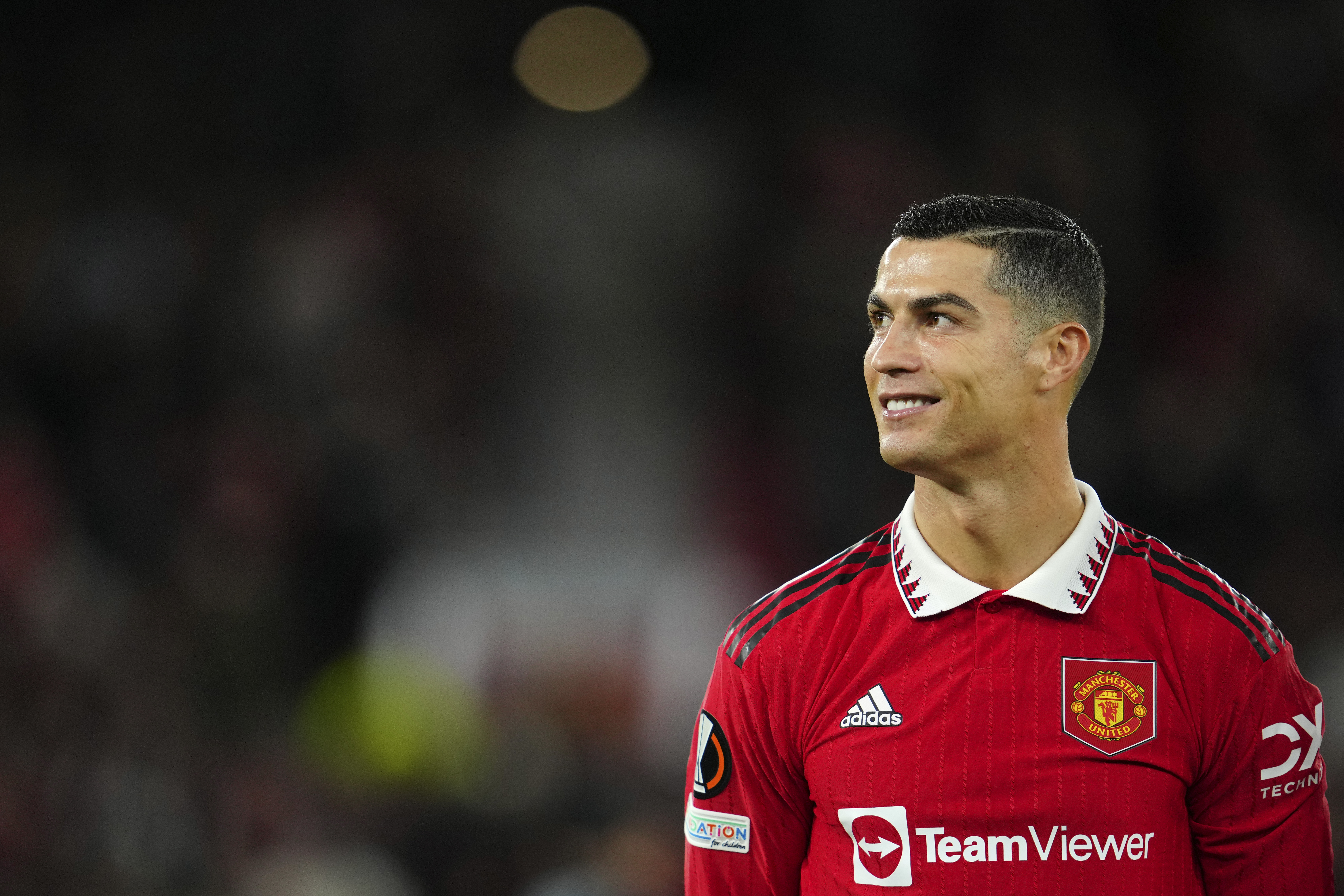 Manchester United's Cristiano Ronaldo smiles before the start of the Europa League group E soccer match between Manchester United and Sheriff at Old Trafford in Manchester, England, Thursday Oct. 27, 2022. 