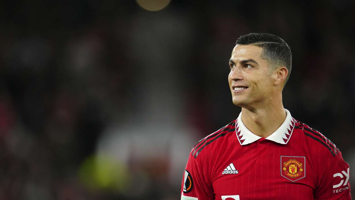 Manchester United's Cristiano Ronaldo smiles before the start of the Europa League group E soccer match between Manchester United and Sheriff at Old Trafford in Manchester, England, Thursday Oct. 27, 2022.