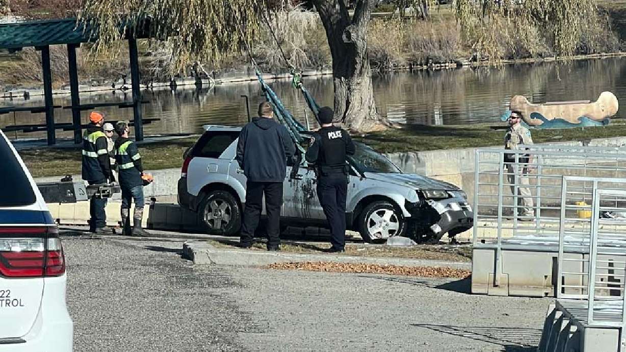 A woman’s vehicle is seen after it had been pulled out of the Snake River in Idaho Falls, Idaho. A Utah man jumped into the Snake River near John's Hole Bridge in Idaho to save the woman after watching her drive her vehicle off the boat dock.