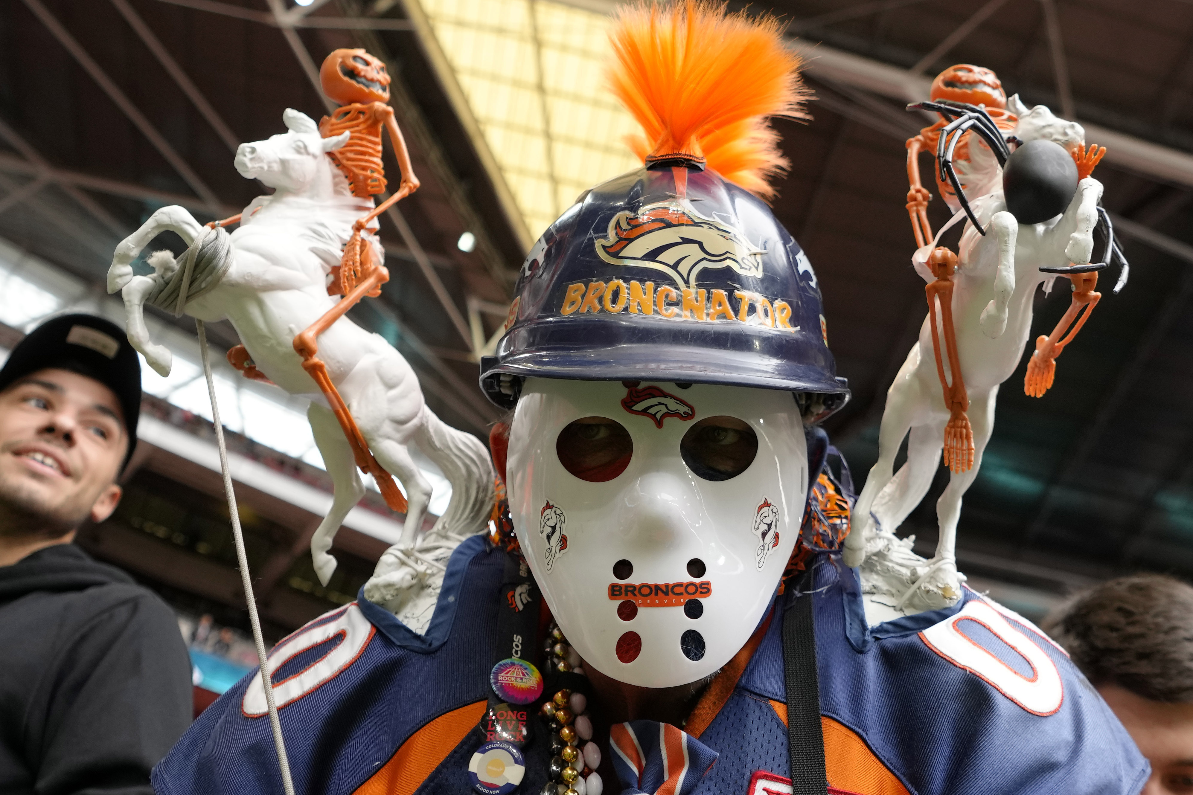 A Denver Broncos supporter cheers before the NFL football game between Denver Broncos and Jacksonville Jaguars at Wembley Stadium London, Sunday, Oct. 30, 2022. 