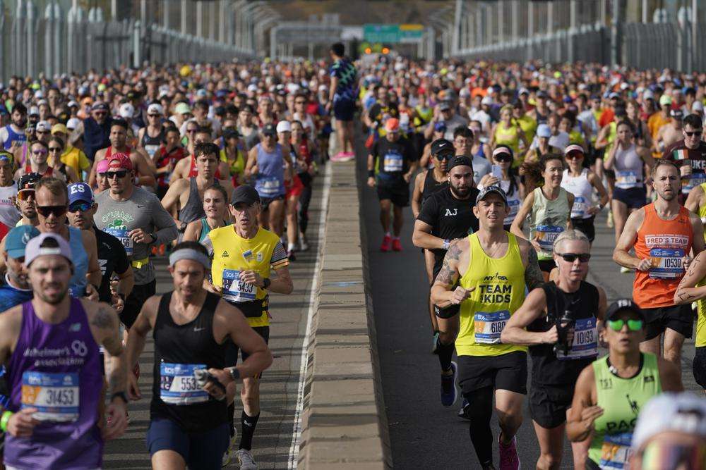 Runners cross the Verrazzano-Narrows Bridge at the start of the New York City Marathon in New York, Sunday, Nov. 6. The world's population is projected to hit an estimated 8 billion people on Tuesday, Nov. 15, according to a United Nations projection.