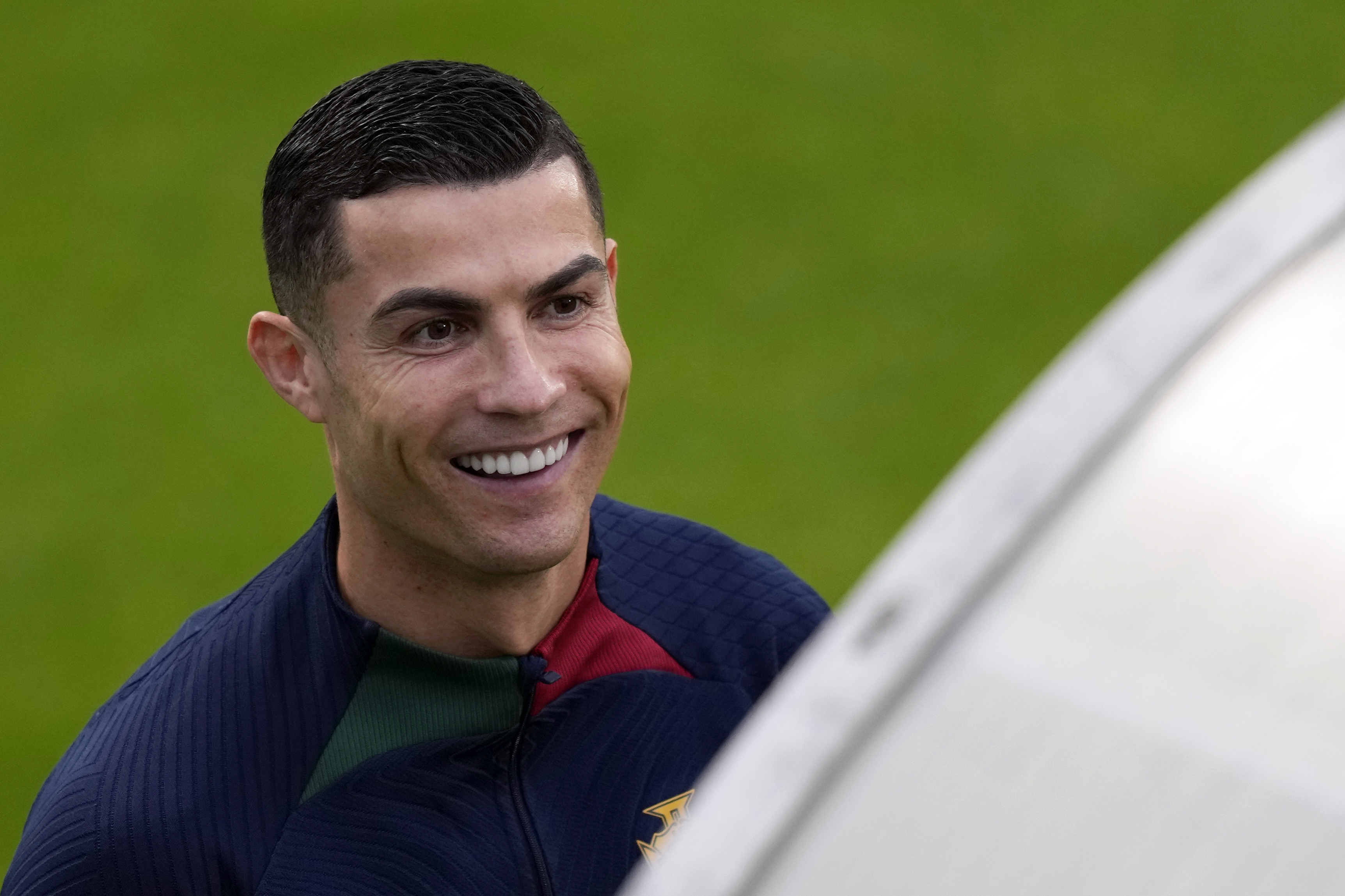 Cristiano Ronaldo smiles as he arrives for a Portugal soccer team training session in Oeiras, outside Lisbon, Monday, Nov. 14, 2022. Portugal will play Nigeria Thursday in a friendly match in Lisbon before departing to Qatar on Friday for the World Cup.