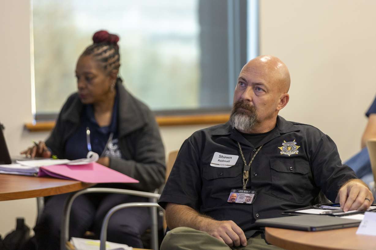 A law enforcement officer listens to Greg Guiton, an Active Bystandership for Law Enforcement instructor, during a training session at the Utah Local Governments Trust in North Salt Lake on Tuesday. The training, developed by Georgetown University, teaches law enforcement officers to support each other by stepping in to prevent officer misconduct and mistakes, regardless of rank or hierarchy.