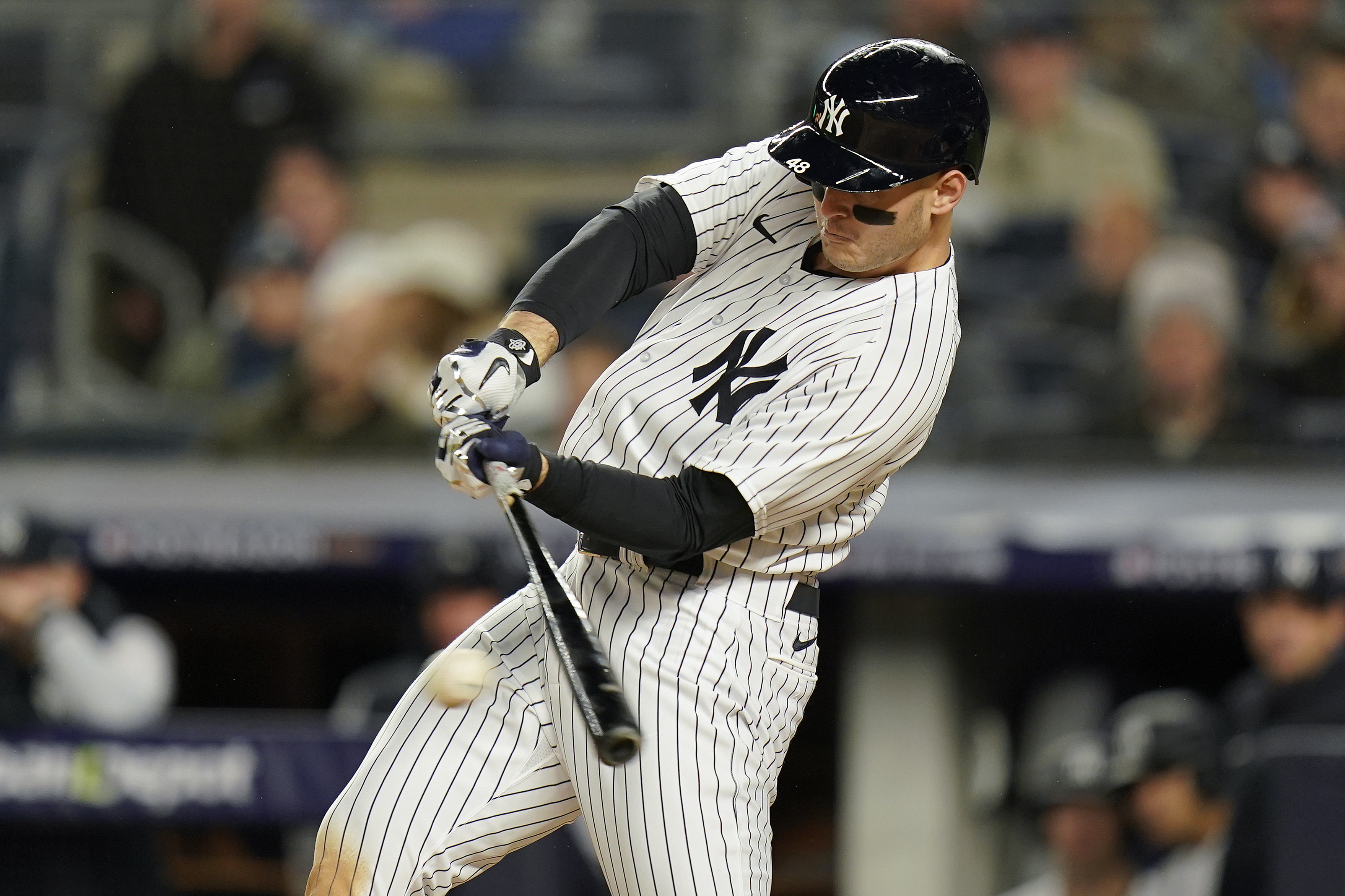 New York Yankees Anthony Rizzo (48) connects for an RBI base hit against the Houston Astros during the fourth inning of Game 4 of an American League Championship baseball series, Sunday, Oct. 23, 2022, in New York. 