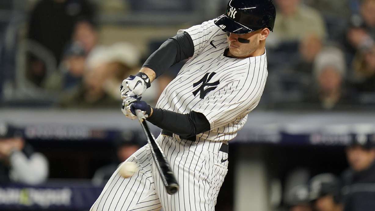 New York Yankees Anthony Rizzo (48) connects for an RBI base hit against the Houston Astros during the fourth inning of Game 4 of an American League Championship baseball series, Sunday, Oct. 23, 2022, in New York.