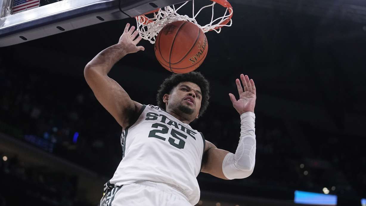 Michigan State forward Malik Hall (25) scores against Kentucky during the second half of an NCAA college basketball game, Tuesday, Nov. 15, 2022, in Indianapolis.