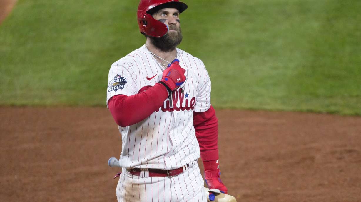Philadelphia Phillies' Bryce Harper walks to the dugout after striking out during the fourth inning in Game 4 of baseball's World Series between the Houston Astros and the Philadelphia Phillies on Wednesday, Nov. 2, 2022, in Philadelphia.