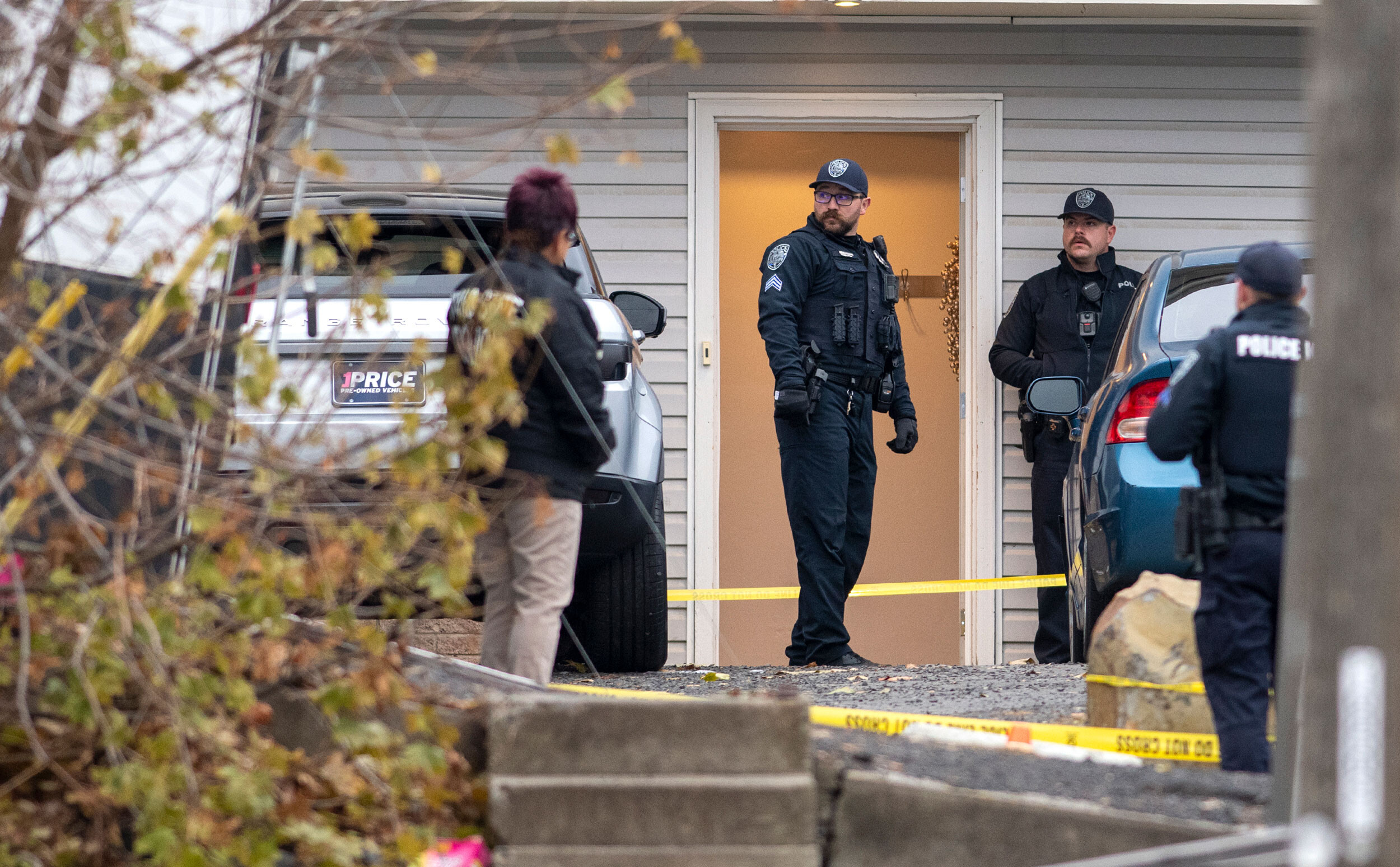 Officers investigate Sunday at the scene of a quadruple homicide in Moscow, Idaho.