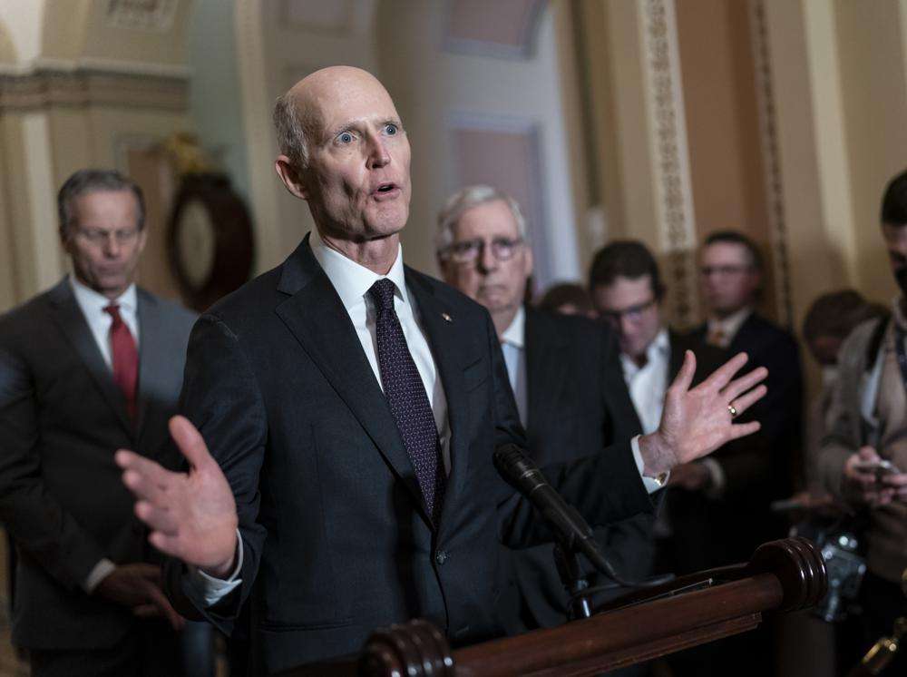 Sen. Rick Scott, R-Fla., speaks as Senate Minority Leader Mitch McConnell, R-Ky., listens at right during a news conference at the Capitol in Washington, March 8. Following the 2022 midterm elections, Scott, an ally of former President Donald Trump, mounted a long-shot bid to unseat McConnell from his longtime position as Senate Republican leader.