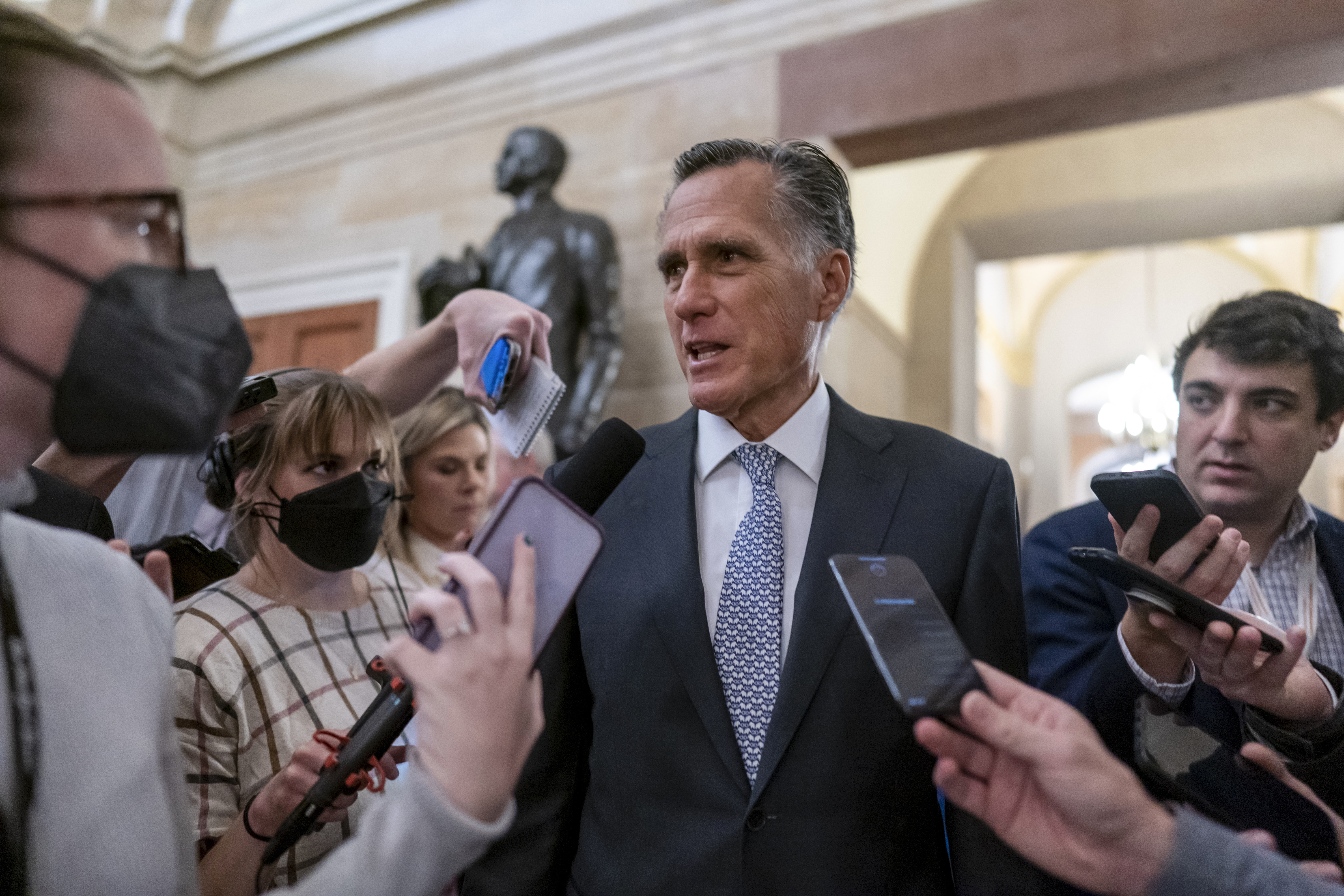 Sen. Mitt Romney, R-Utah, arrives at the Old Senate Chamber at the Capitol in Washington, Nov. 16, 2022. The Senate passed a resolution sponsored by Romney to codify a dress code on Wednesday.
