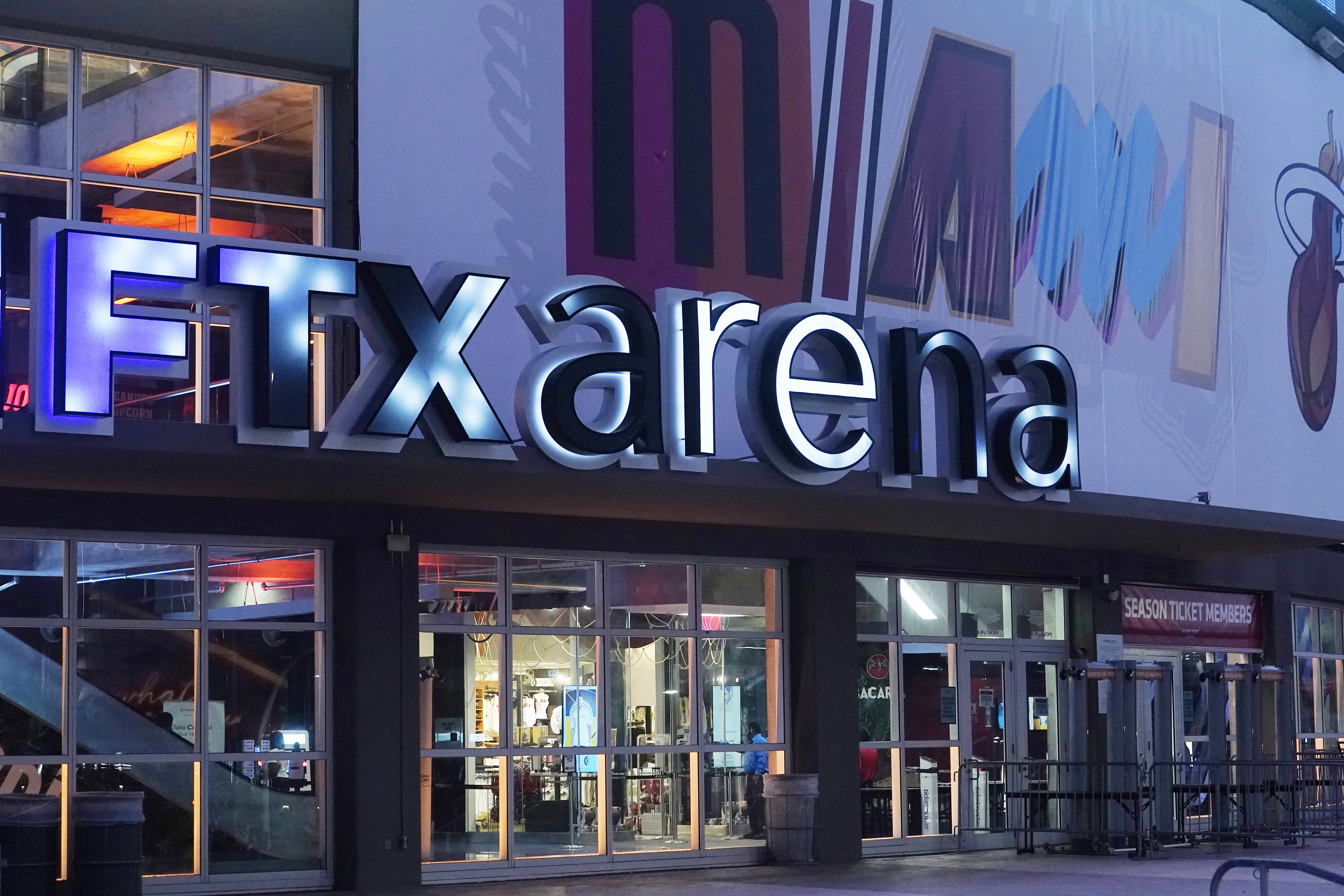FILE - A sign for the FTX Arena, where the Miami Heat basketball team plays, is illuminated on Nov. 12, 2022, in Miami. FTX filed for bankruptcy protection Friday, Nov. 11.